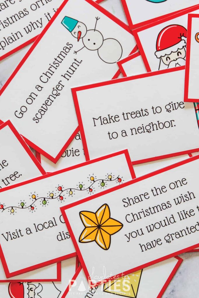 close up image of a pile of cards with brightly colored holiday images and activity suggestions typed on each card