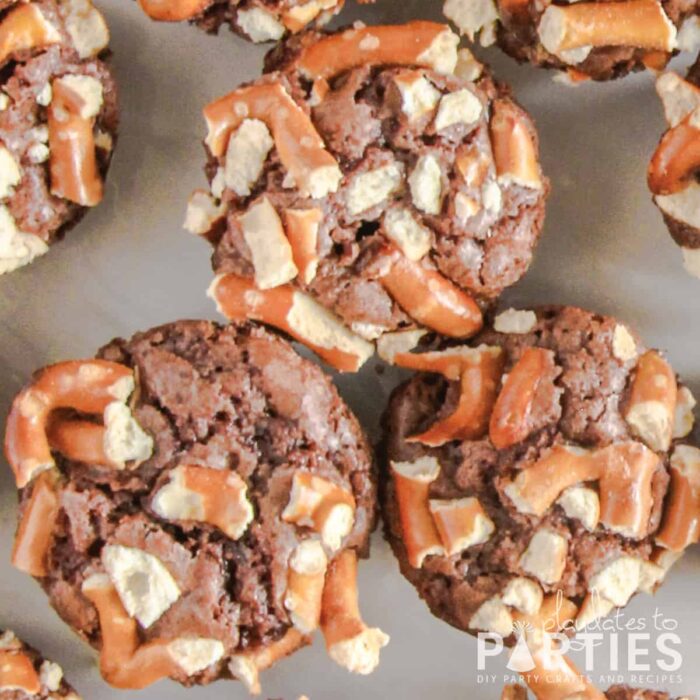 close up of brownies on a white plate