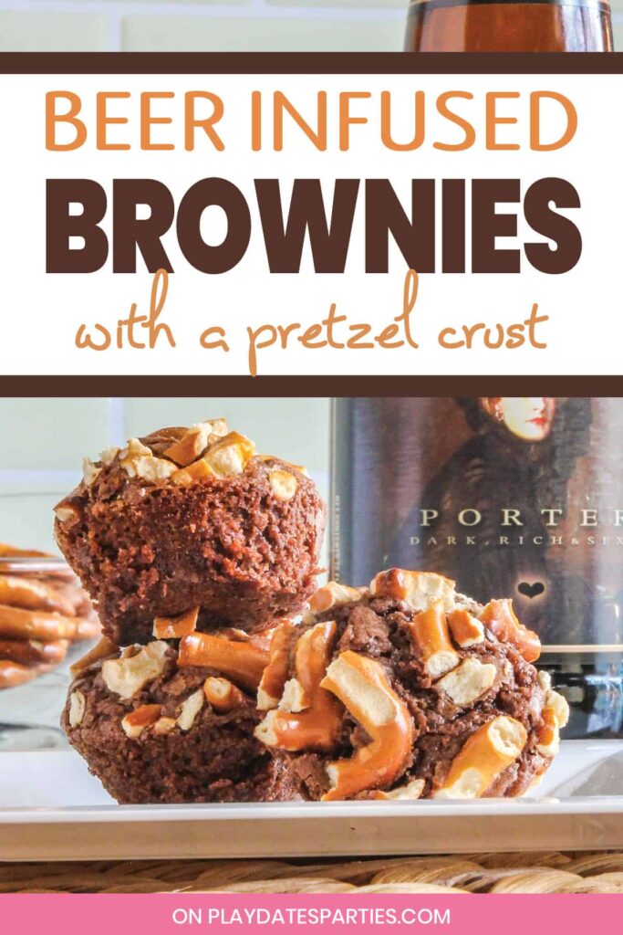 Three brownie bites topped with pretzel pieces sitting on a white plate in front of a bottle of beer with the text beer infused brownies with a pretzel crust