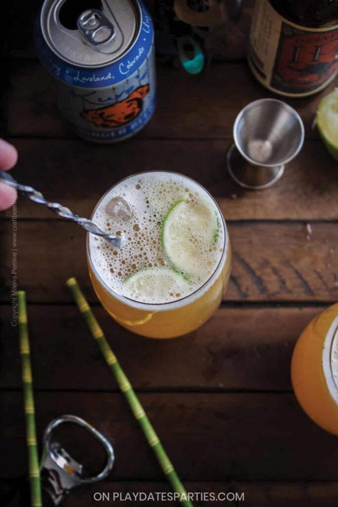 Overhead view of a mixed drink being stirred