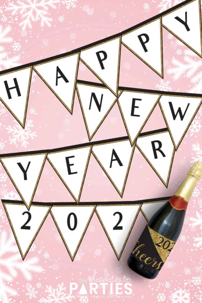 happy new year banner with black letters and a champagne bottle