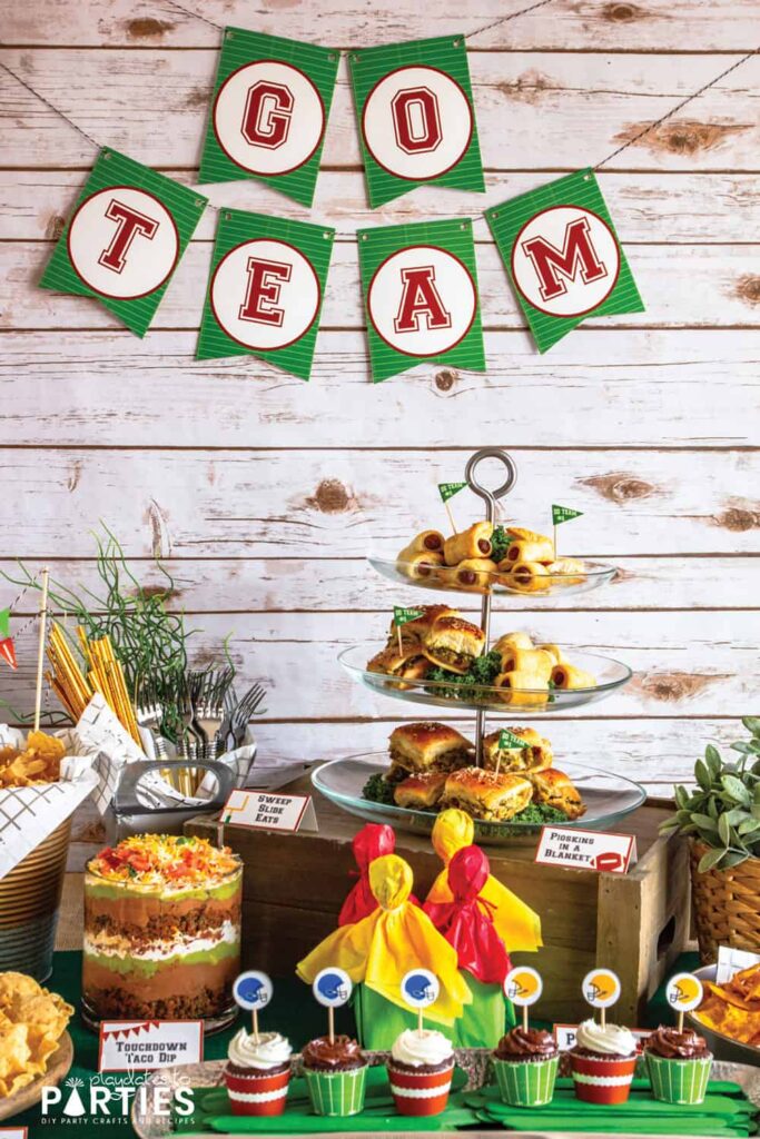 photo of a buffet table with game day food and a banner that says go team