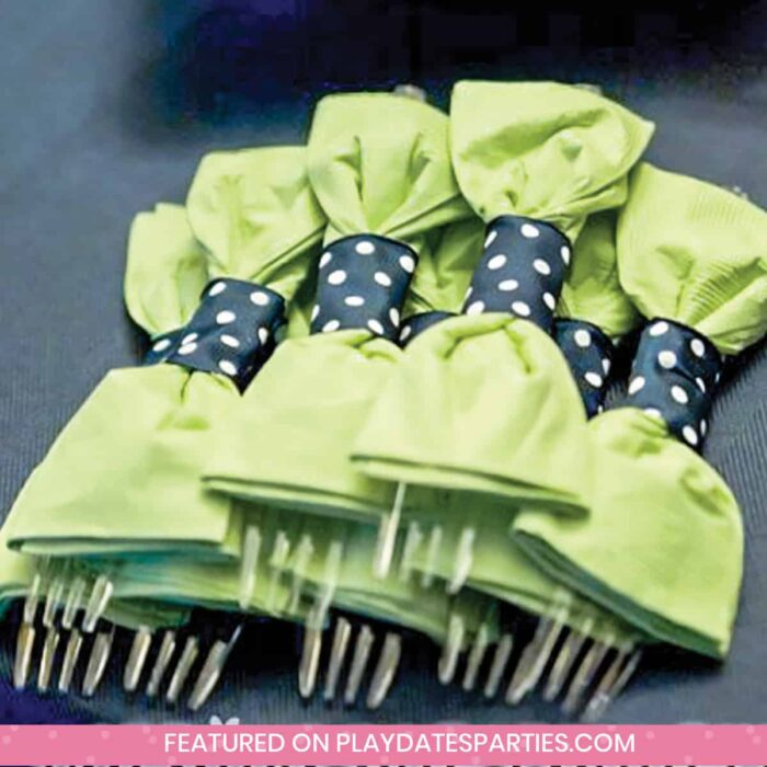 forks wrapped up for a party to look like green bowties