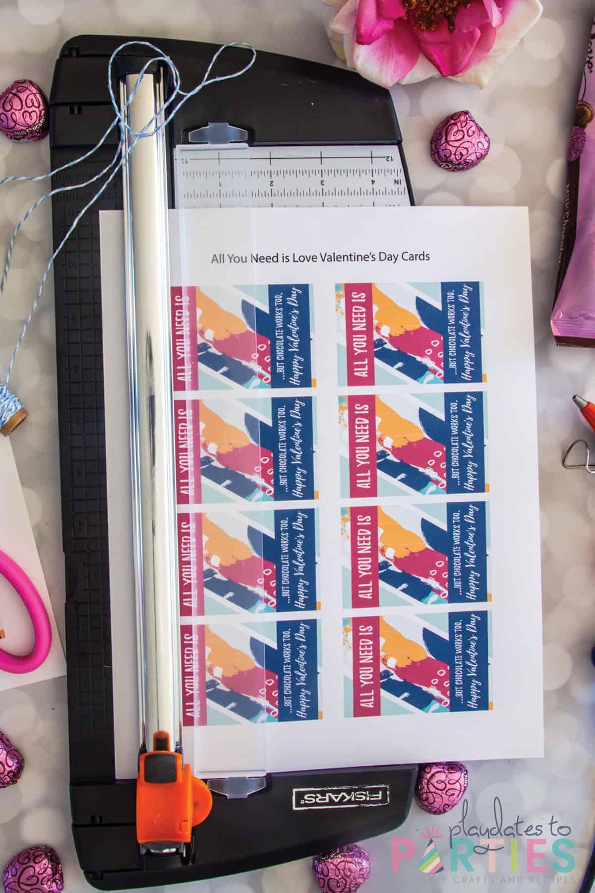photo of printed page with 8 Valentine's on the page in a paper trimmer