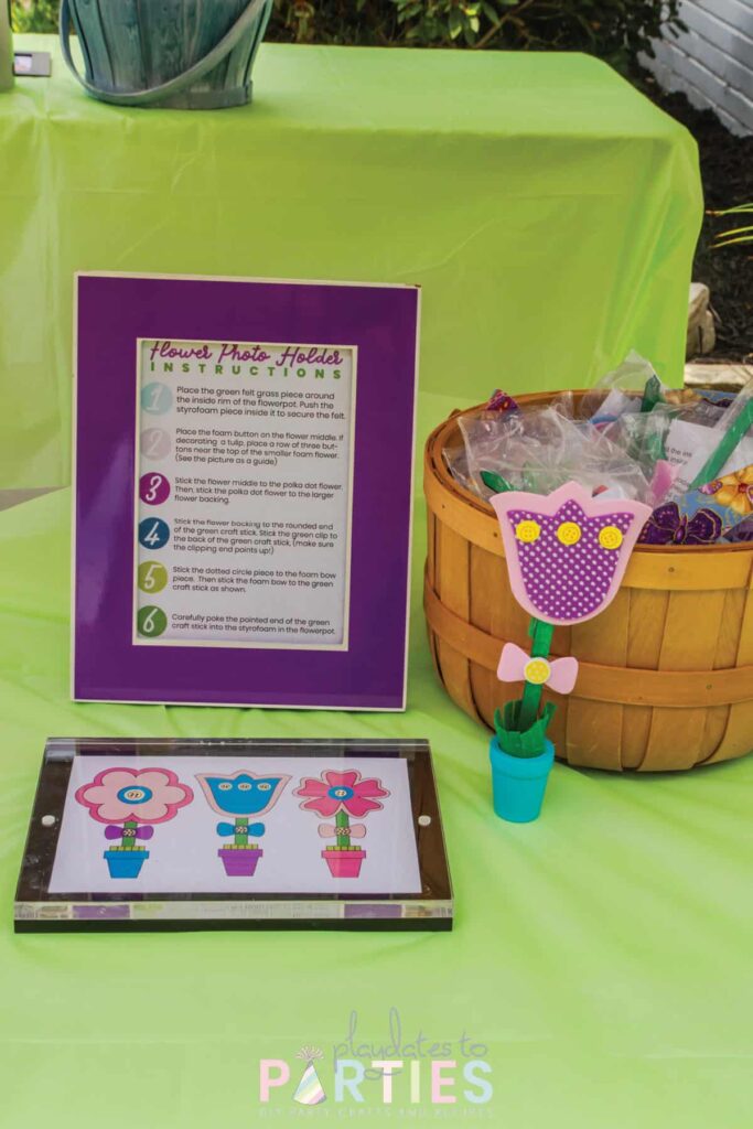 craft station with a sample of a flower craft and framed directions