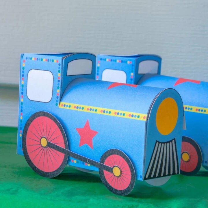 closeup of a three dimensional favor box that looks like a blue train