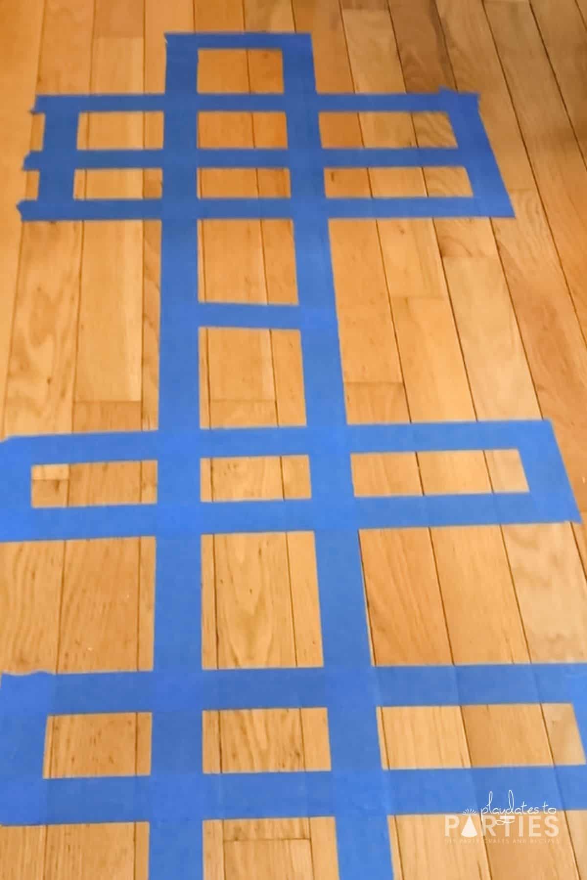 A finished course on a hardwood floor made with painter's tape