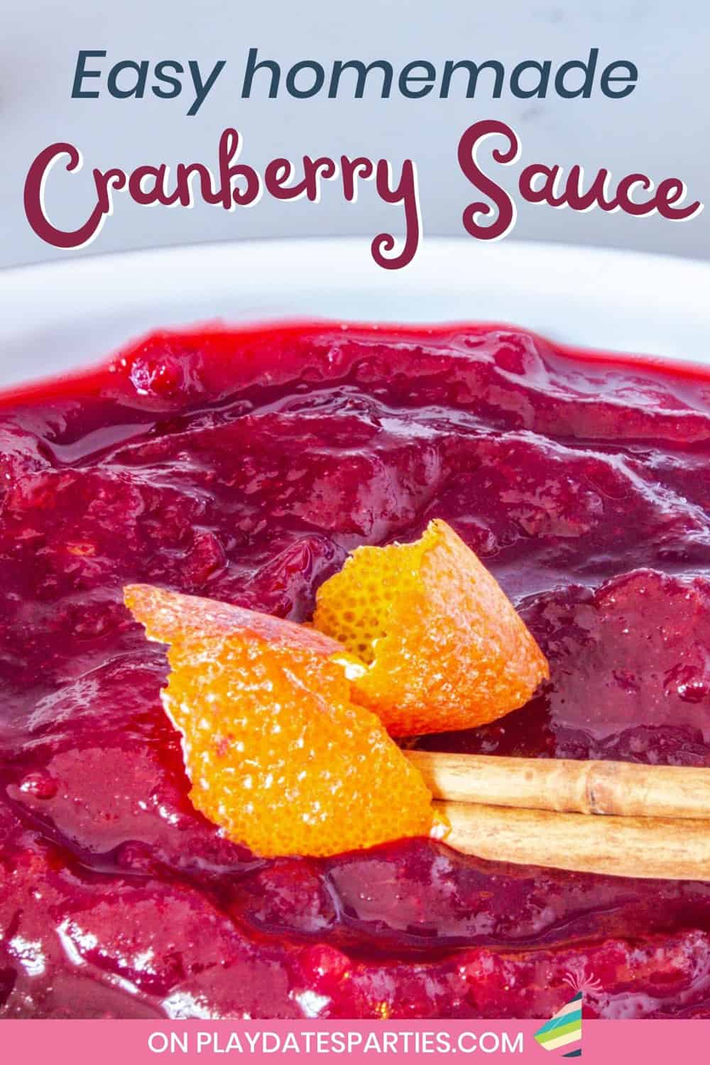 Close up of cranberry sauce garnished with cinnamon and orange peel.