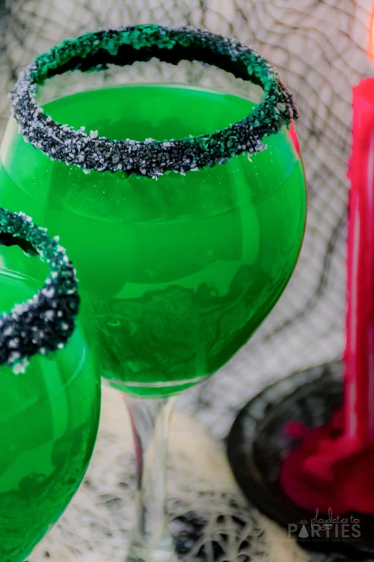 Slightly overhead view of a Frankenstein margarita in a large wine glass.