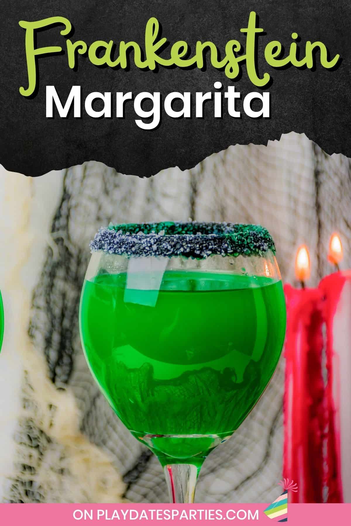 Close up of a wine glass rimmed with black and white margarita salt, and filled with a green cocktail.