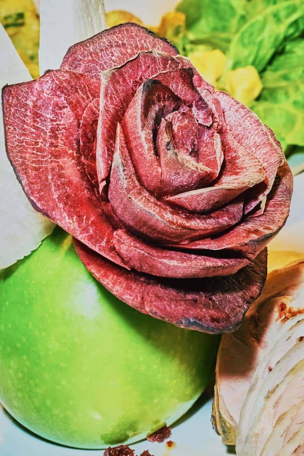 A rose made out of deli meat.