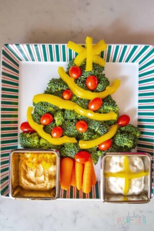 Christmas tree veggie platter for kids on a square platter.