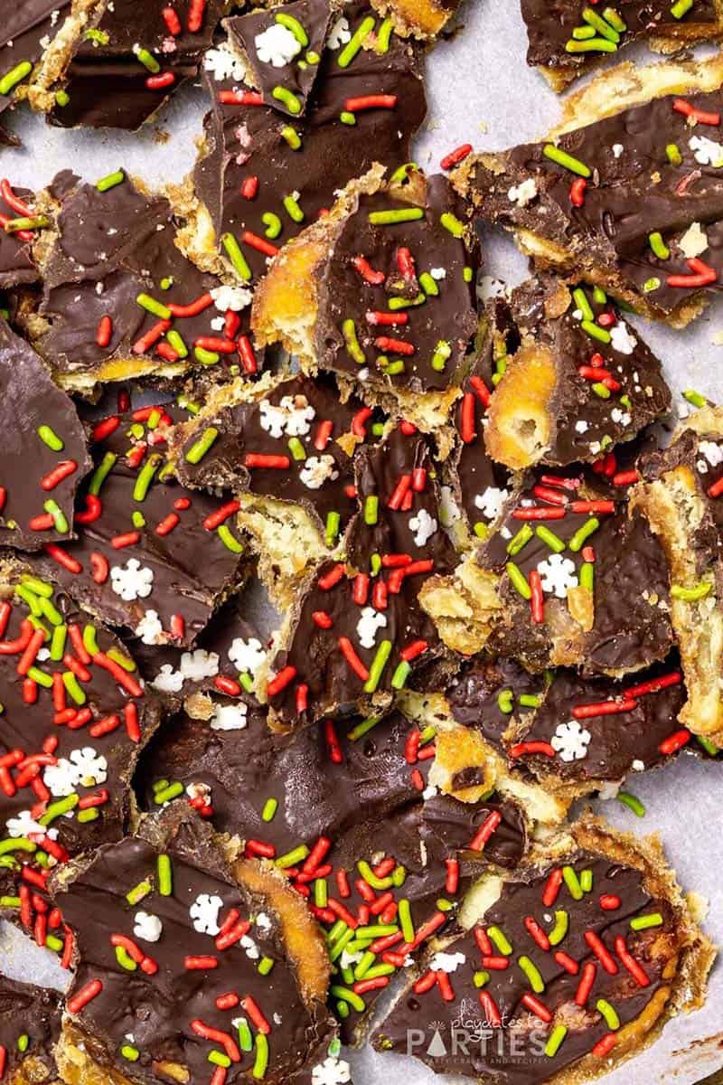 Overhead view of candy made with crackers, chocolate, and Christmas sprinkles.