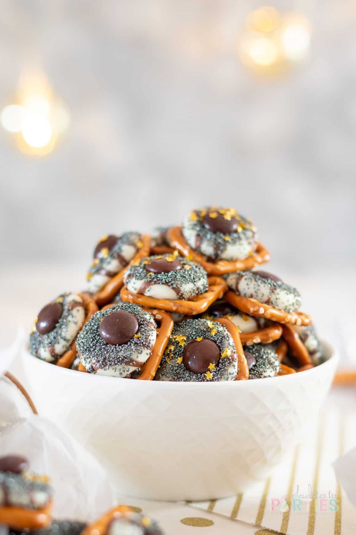 A white bowl filled with pretzel treats for New Year's Eve.