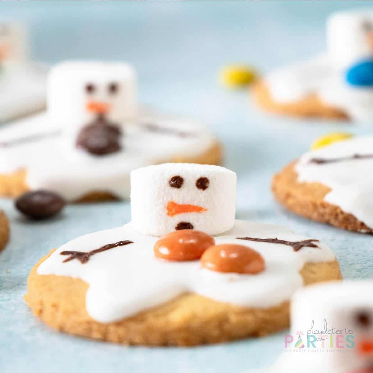 Front view of a Christmas cookie that looks like a melting snowman.