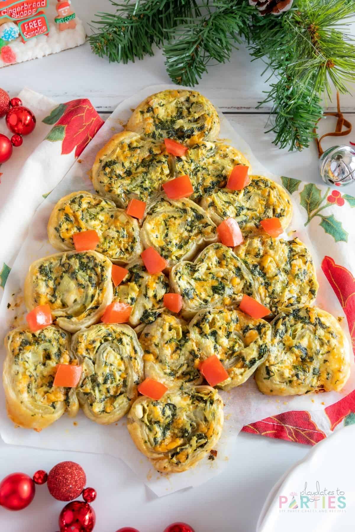 Overhead view of a spinach artichoke Christmas tree appetizer made with puff pastry.