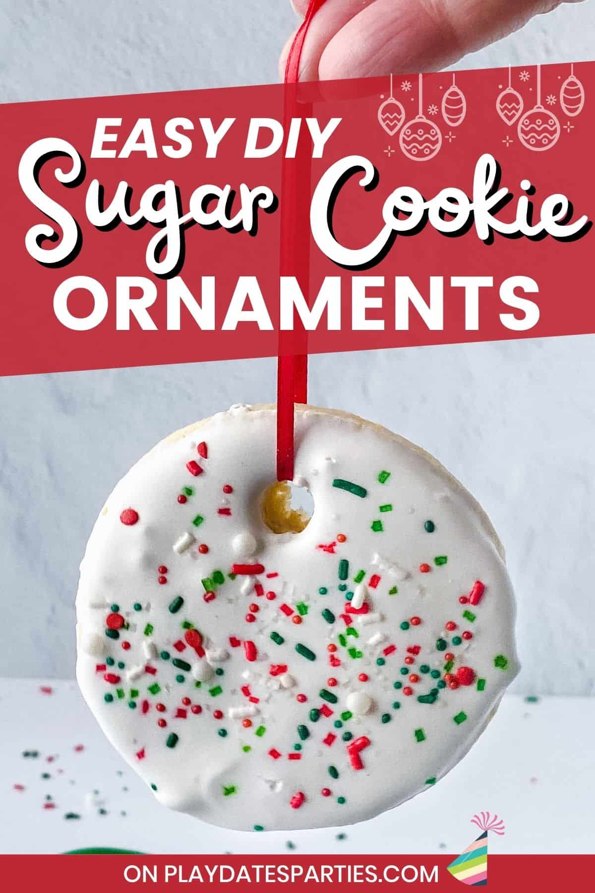 An ornament cookie hanging from a ribbon with text overlay how to make sugar cookie ornaments.