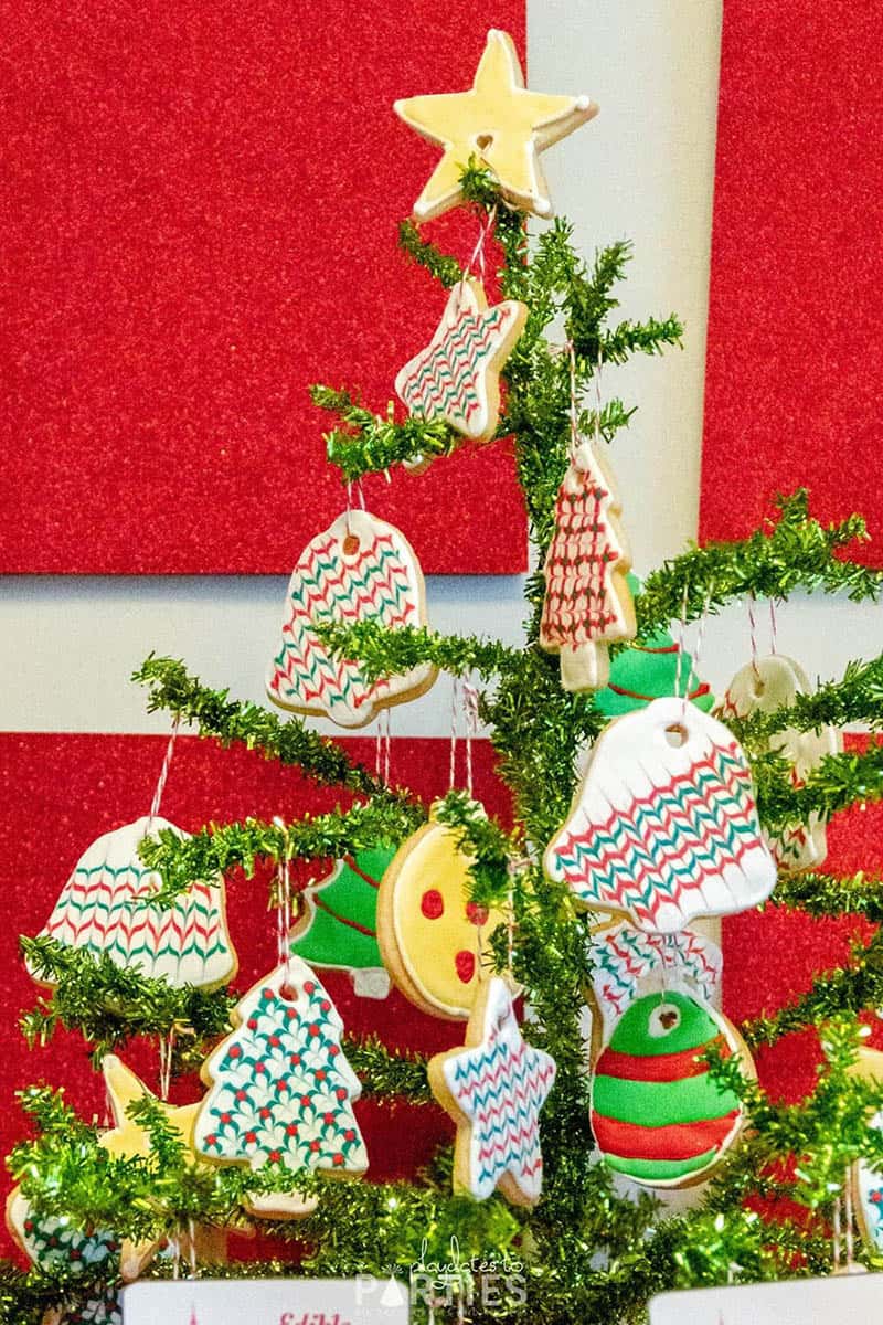A Christmas tree decorated with a variety of sugar cookie ornaments.