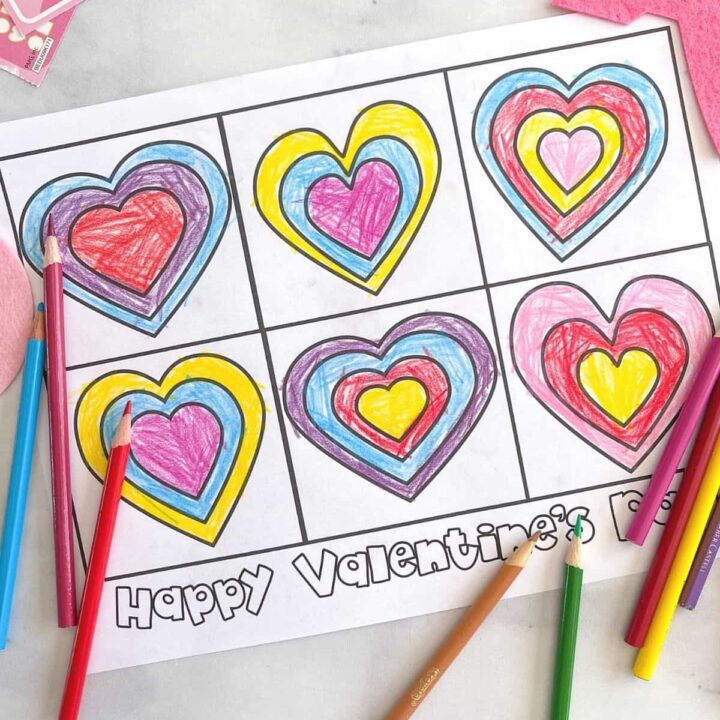 A free printable Valentine's Day coloring page with hearts surrounded by colored pencils.