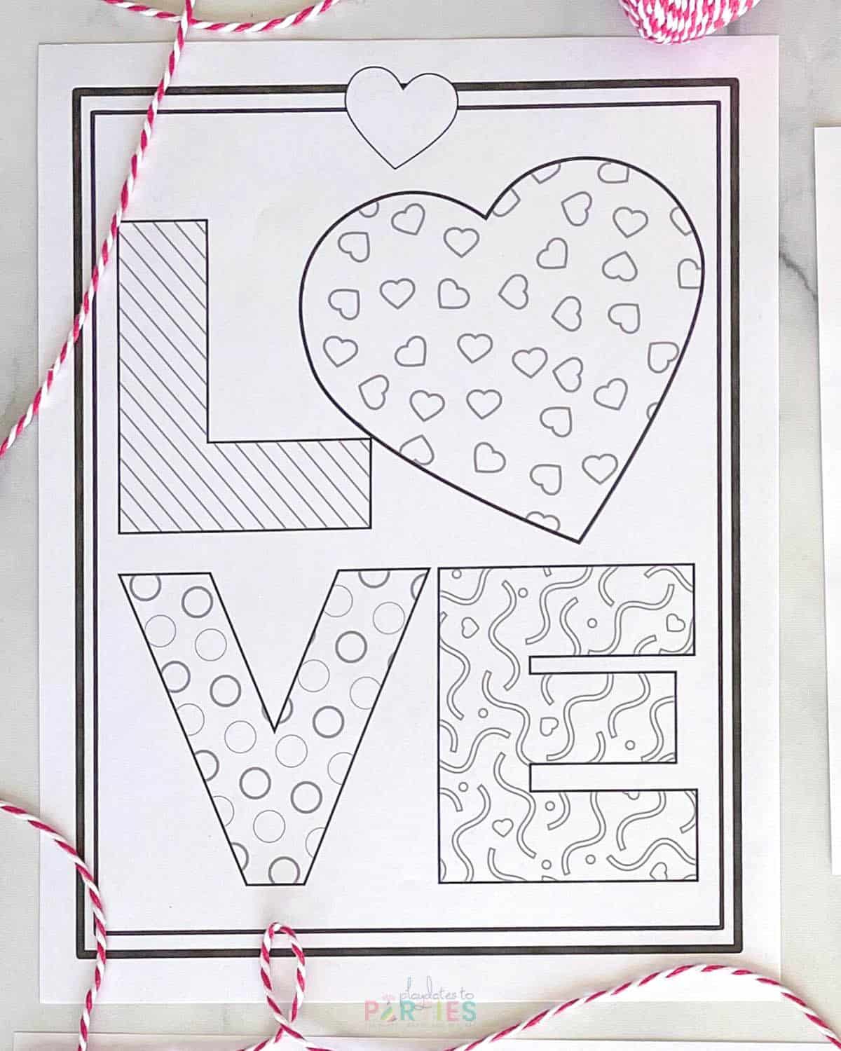 A blank coloring sheet with patterned letters for LOVE.