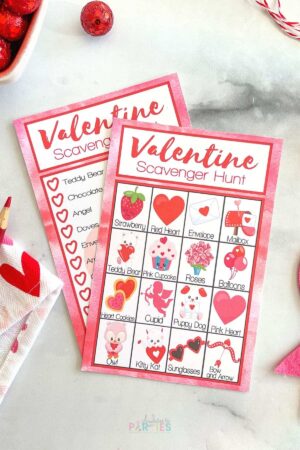 Two printable Valentine's Day games on a marble surface.