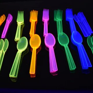 Colorful rainbow glowing forks and spoons.