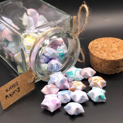 Origami paper stars in a jar.