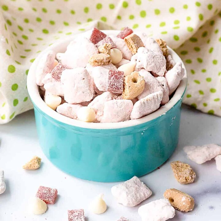 Pink strawberry cheesecake puppy chow snack mix.