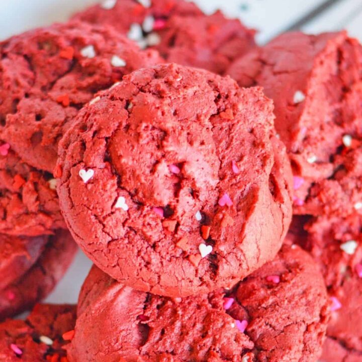 Overhead view of red velvet cake mix cookies with sprinkles.