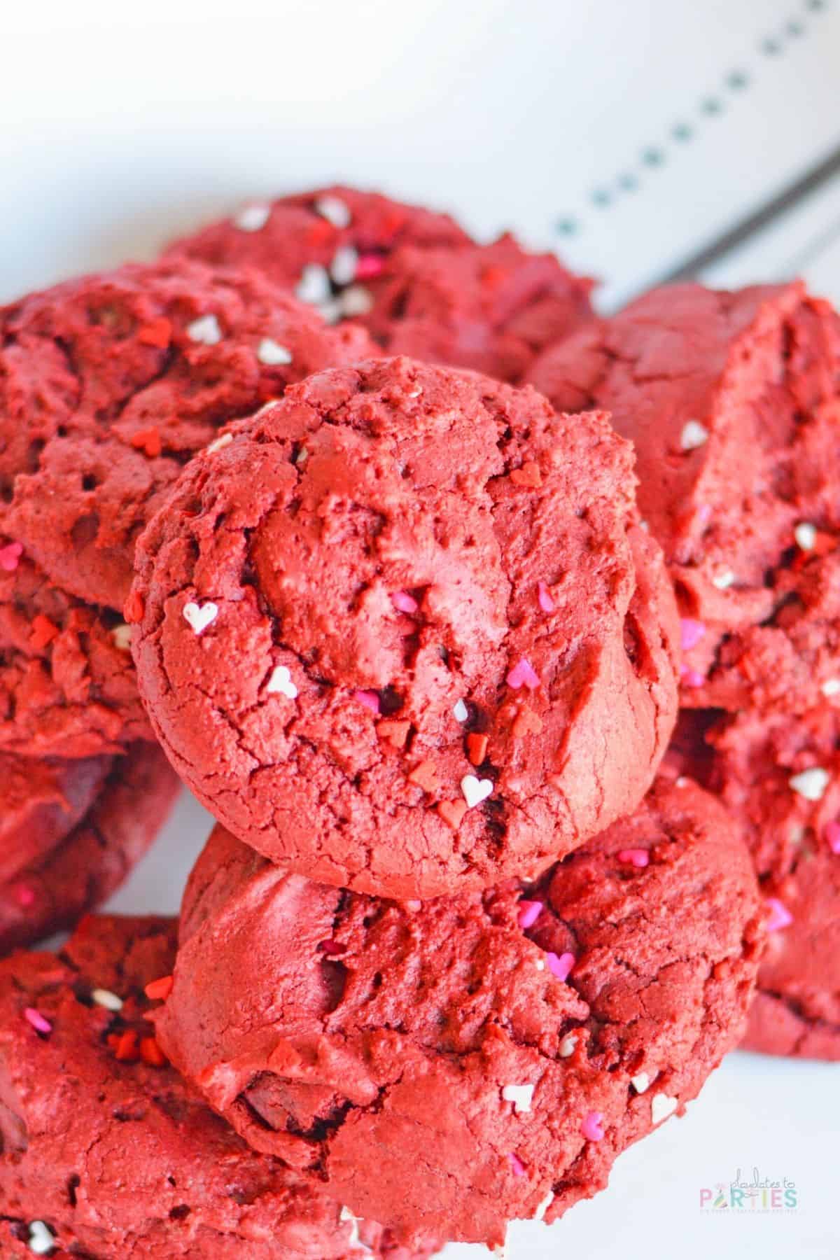 Overhead view of red velvet cake mix cookies with sprinkles.