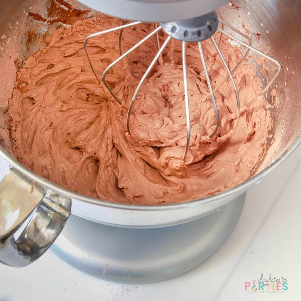 Finished chocolate beer whipped cream frosting in a stand mixer.