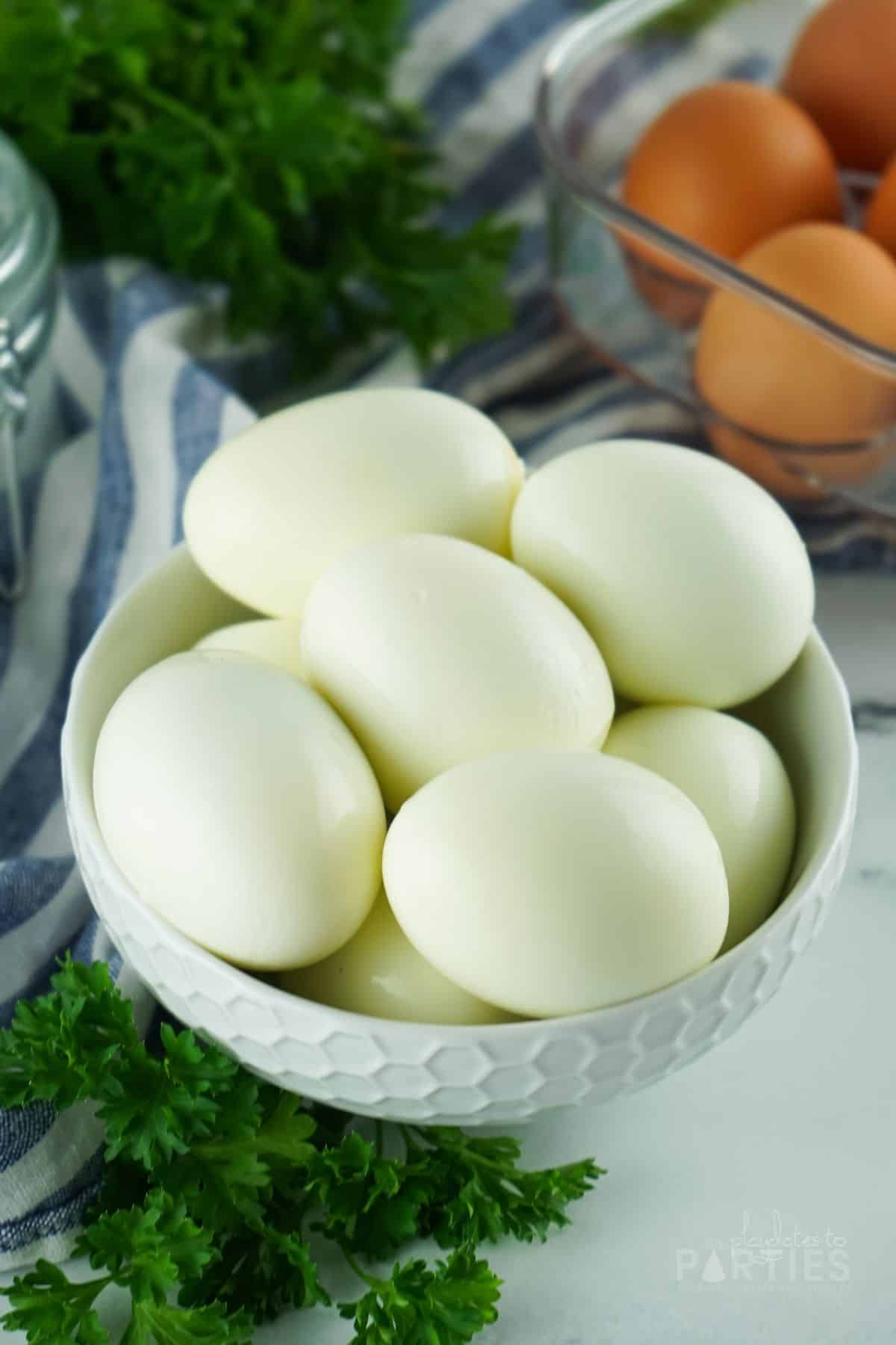 Peeled eggs in a bowl with no blemishes.