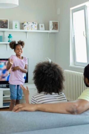 A family playing charades for Mother's Day.