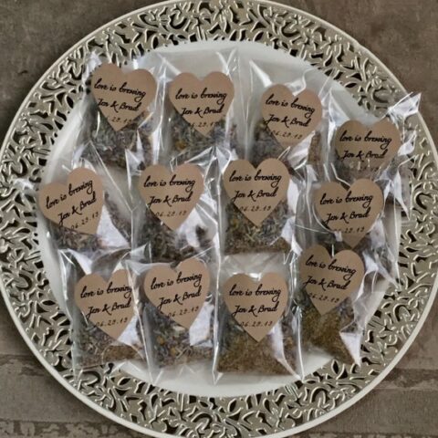 Specialty tea bags for a bridal shower tea with tags that say love is brewing.