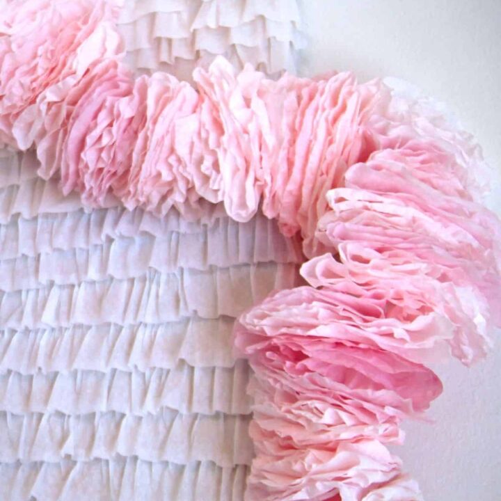A ruffly pink garland made out of coffee filters.