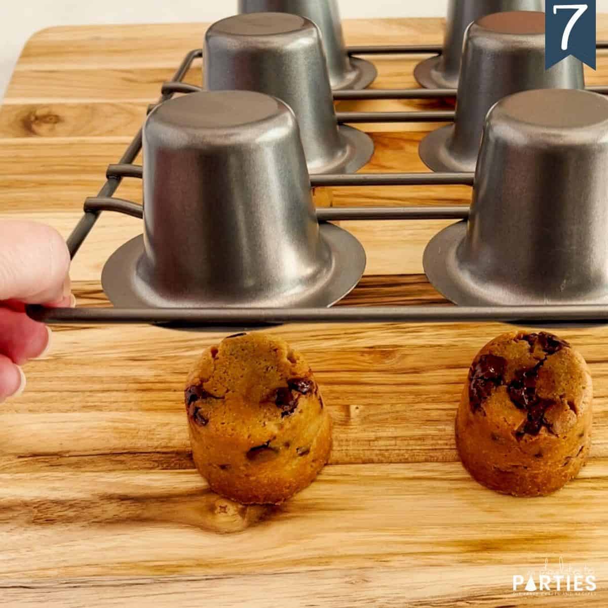 Removing cookie shooters from a popover pan.