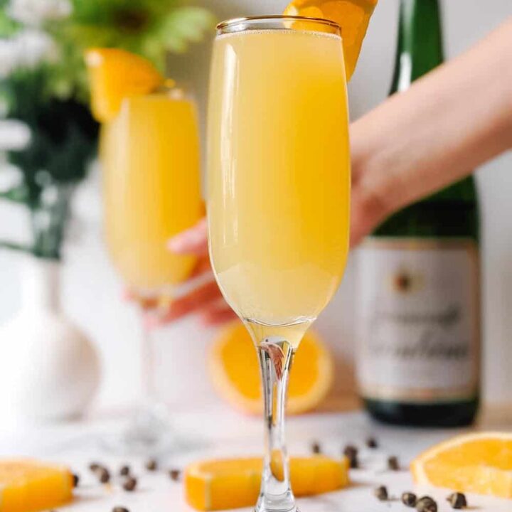 A champagne flute filled with Jasmine green tea mimosas.