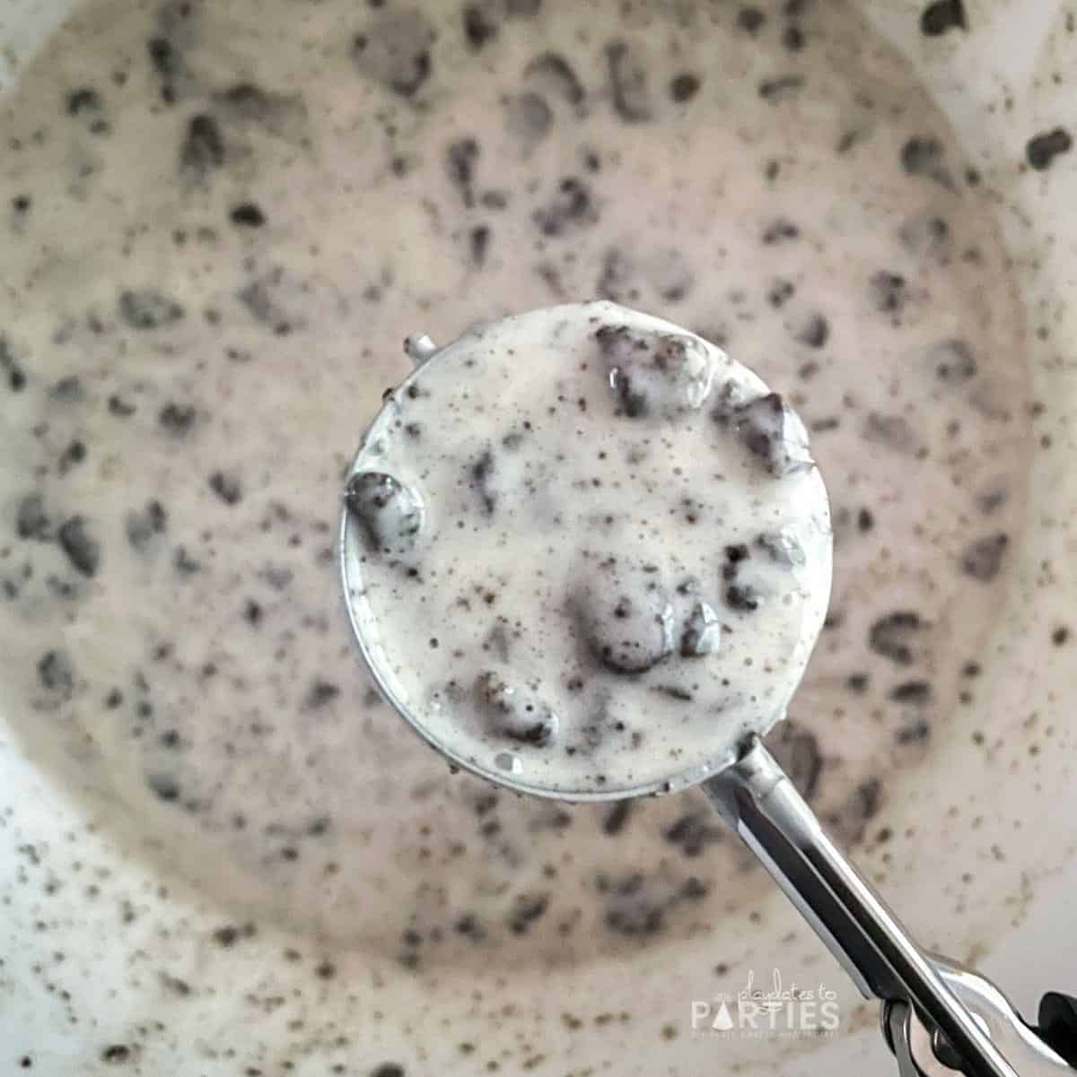 Scooping Oreo Cupcake Batter with a Cookie Scoop.