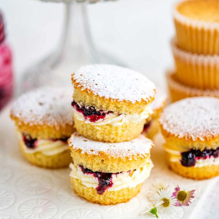 Sponge cupcakes cut in half and filled with jam and cream.