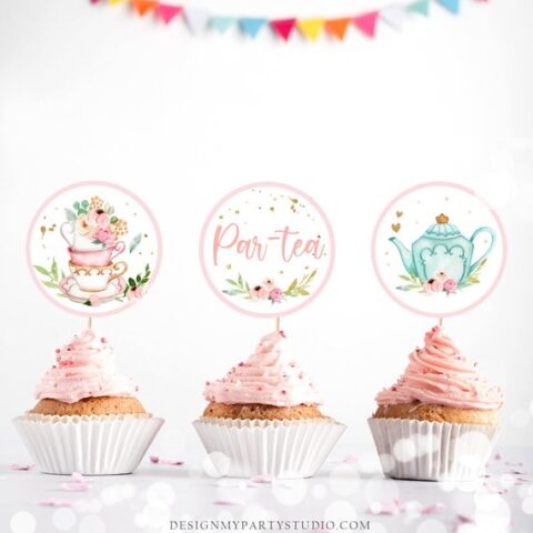 Cupcakes with pink frosting and tea party themed toppers.