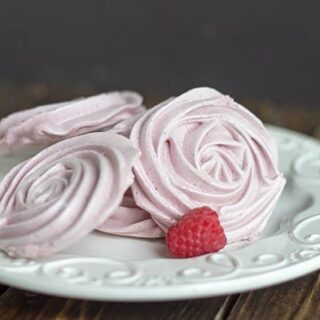A plate of raspberry meringue cookies that look like rosettes.
