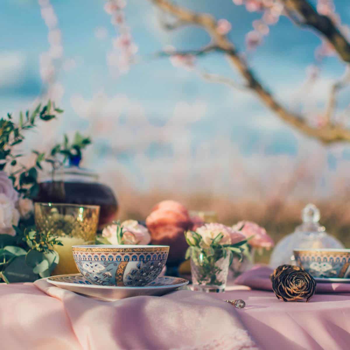 A table decorated outside for a garden tea party.