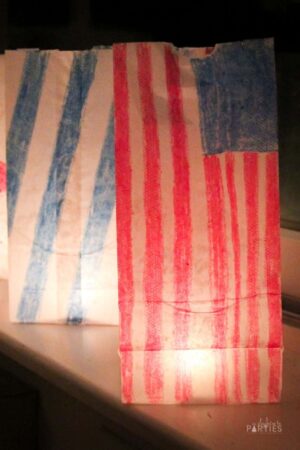 paper bag luminary decorated with the American flag.