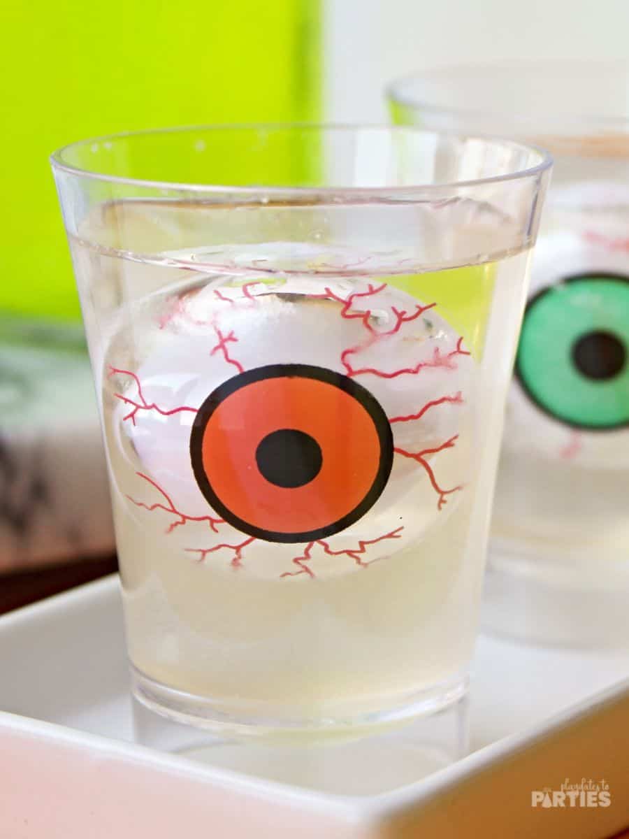 Close up of a jello shot with a floating eyeball inside.