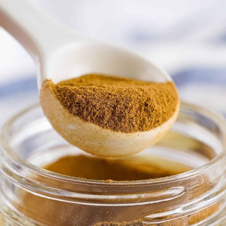 A teaspoon is used to measure out homemade apple pie spice mix.