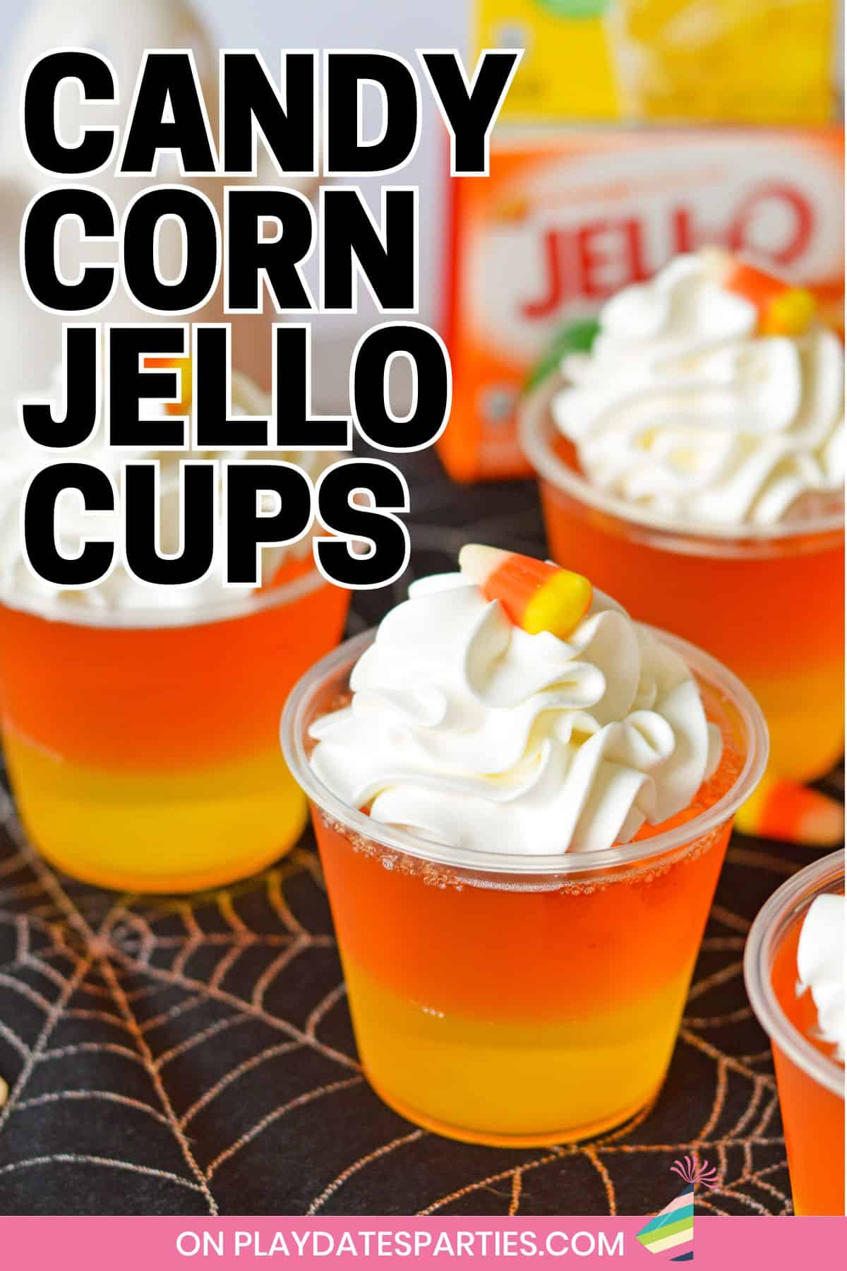 Layered jello cups with text overlay candy corn jello cups.