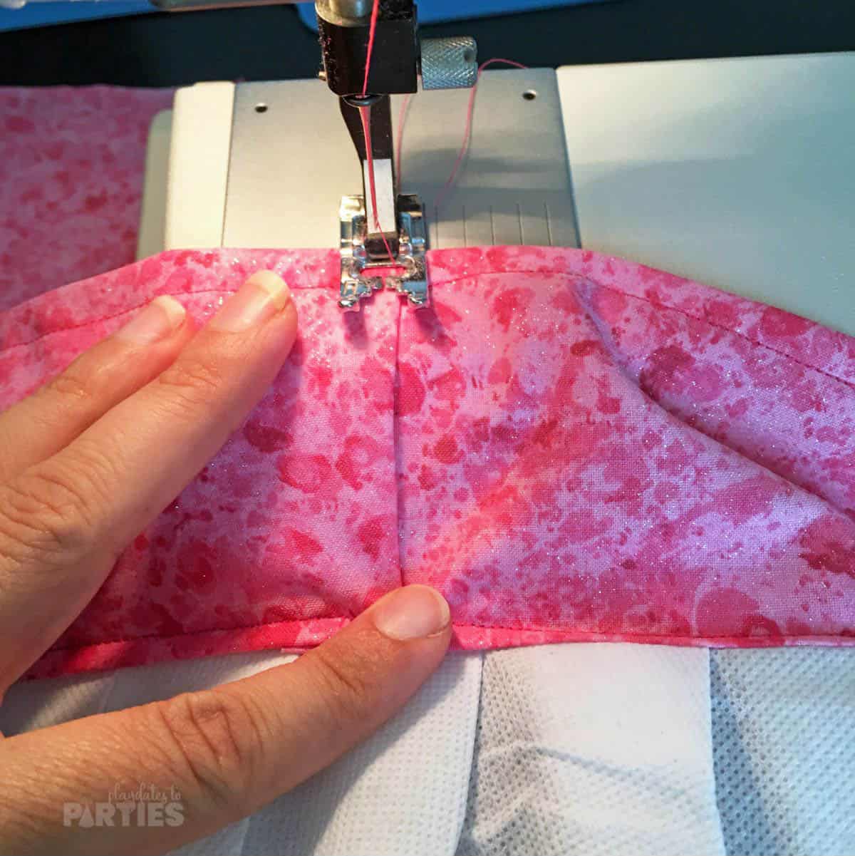 Sewing the ends of a fabric band together.