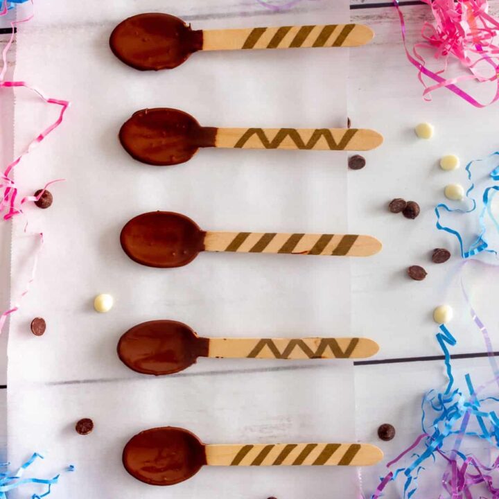 Wood spoons dipped in chocolate with decorated handles.
