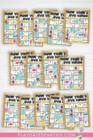 14 colorful New Year's Eve bingo cards against a white brick backgrop.