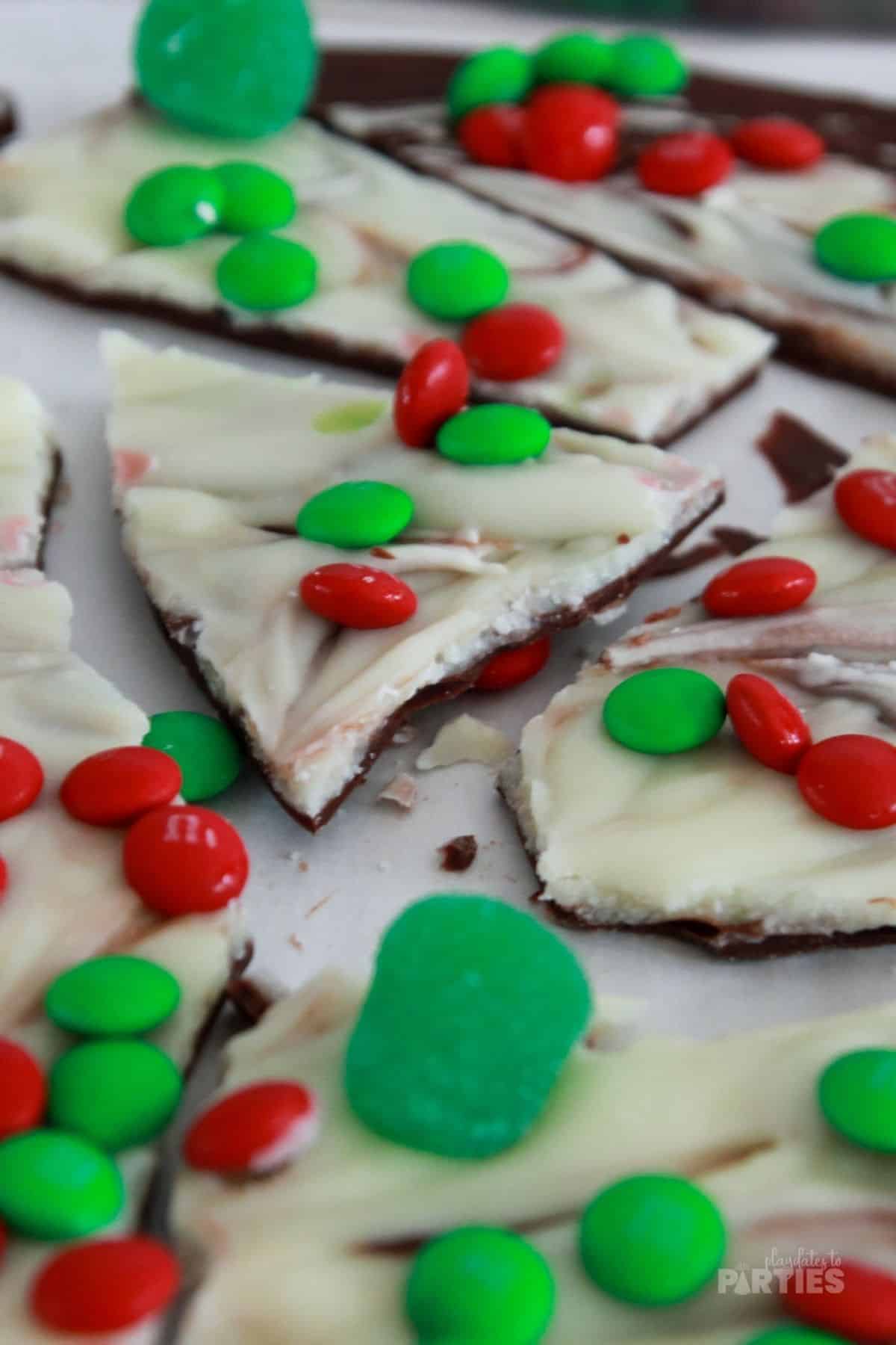 Pieces of holiday candy with M&Ms and gumdrops.